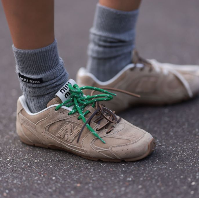 paris, france march 05 a guest seen wearing miu miu x new balance beige sneaker and miu miu grey wool socks outside miu miu show during the womenswear fallwinter 20242025 as part of paris fashion week on march 05, 2024 in paris, france photo by jeremy moellergetty images