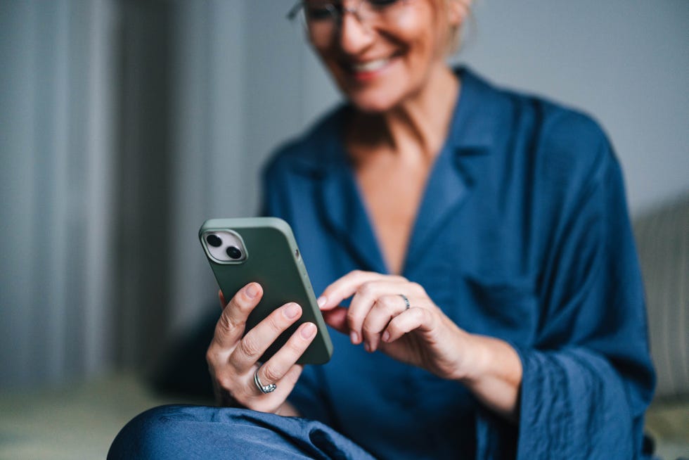 close up of woman holding mobile phone