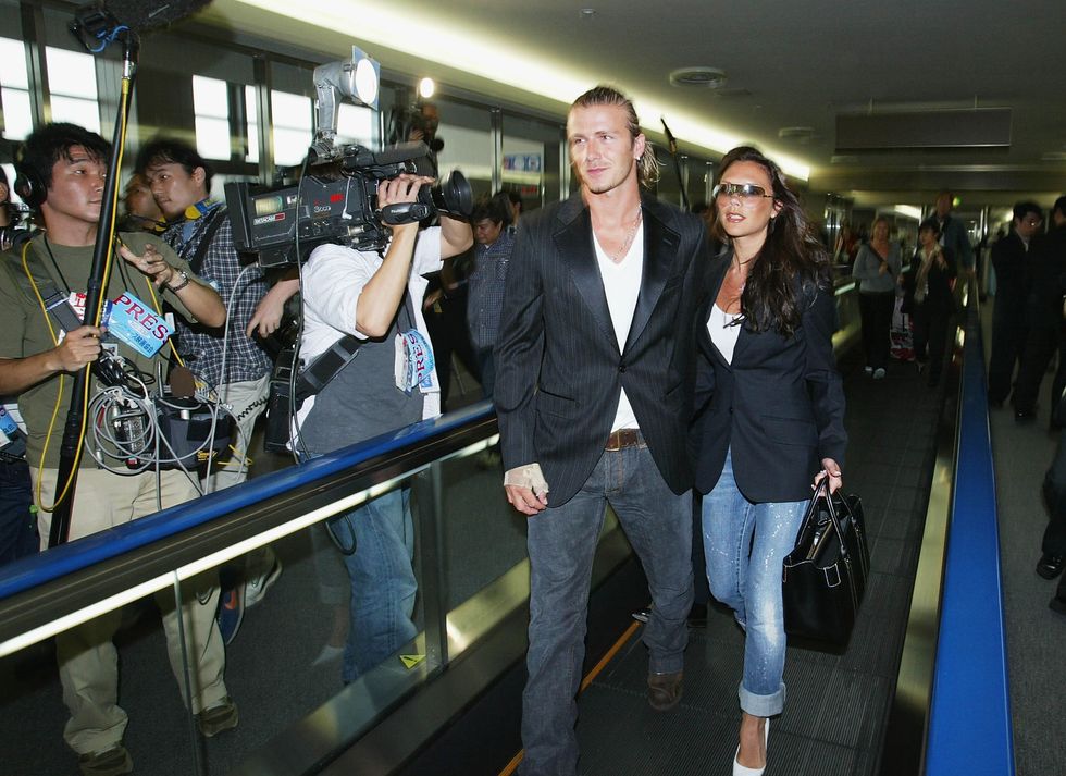 narita, japan june 18 english footballer david beckham and his wife victoria arrive at new tokyo international airport on june 18, 2003 in narita, chiba prefecture, japan the england mid fielder beckham 28, has ended weeks of speculation by agreeing personal terms on a four year contract from manchester united to spanish football giants real madrid, worth 245m photo by koichi kamoshidagetty images