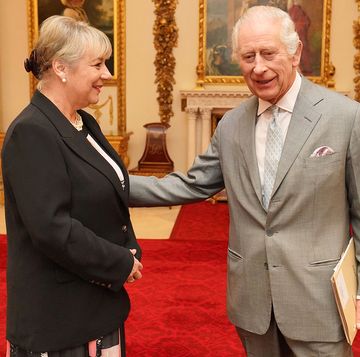 britain's king charles iii greets martina milburn, ceo of the prince's trust, prior to an audience with community faith leaders from across the uk in the billiard room, at buckingham palace in london on march 26, 2024 photo by jonathan brady pool afp photo by jonathan bradypoolafp via getty images