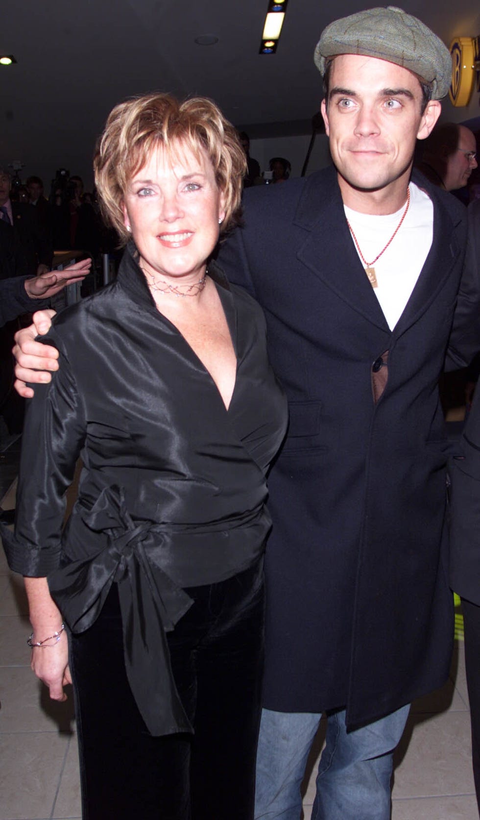 london november 6 british singer robbie williams with his mother at the premiere of nobody someday at the warner cinema, shepherds bush, london on november 6, 2001 nobody someday is a film about williams life photo by dave hogangetty images