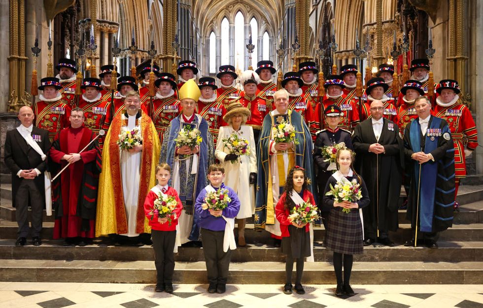 worcester, england march 28 queen camilla holds the nosegay bouquets as she poses with yeomen of the guard and and religious representatives during the royal maundy service at worcester cathedral on march 28, 2024 in worcester, england the royal maundy is an ancient ceremony, inspired by the bible on the day before good friday, jesus washed the feet of his disciples and commanded them to love one another by the thirteenth century the royal family was taking part in similar ceremonies queen camilla distributes maundy money to a selected group of christians to thank them for their work within the church king charles is unable to attend due to him fighting an illness on march 28, 2024 in worcester, england photo by chris jacksongetty images