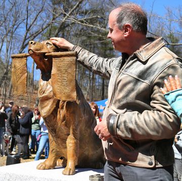 ashland, ma march 30 a statue was dedicated to honor spencer, a golden retriever therapy dog who became the official dog of the boston marathon spencer from holliston stood on the course in ashland and held a boston strong flag in its mouth the dog died from cancer on feb 17, 2023 photo by john tlumackithe boston globe via getty images