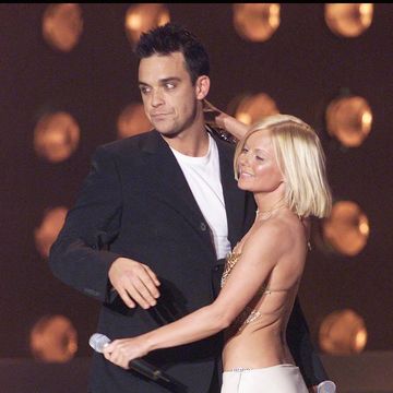 london february 26 robbie williams and geri halliwell embrace at the brit awards, earls court, london, february 26, 2001 geri was presenting robbie with the award for best british male photo by dave hogangetty images