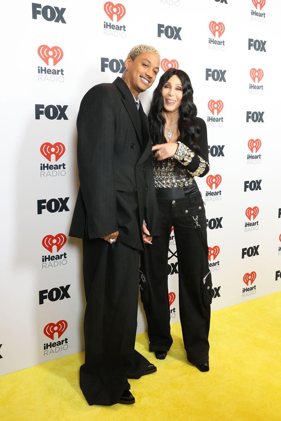 hollywood, california april 01 l r alexander edwards and cher pose in the press room during the 2024 iheartradio music awards at dolby theatre on april 01, 2024 in hollywood, california photo by aliah andersonwireimage