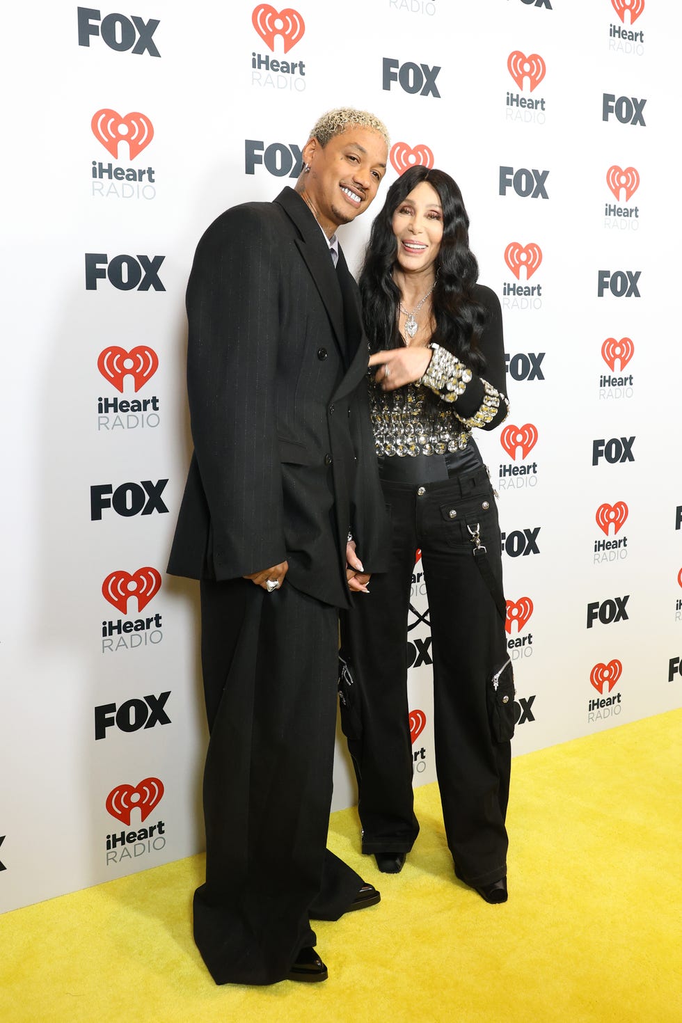 hollywood, california april 01 l r alexander edwards and cher pose in the press room during the 2024 iheartradio music awards at dolby theatre on april 01, 2024 in hollywood, california photo by aliah andersonwireimage