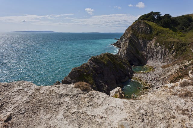 dorset coastline at lulworth cove. dorset, england. (photo by: doug mckinlay/design pics editorial/universal images group via getty images)