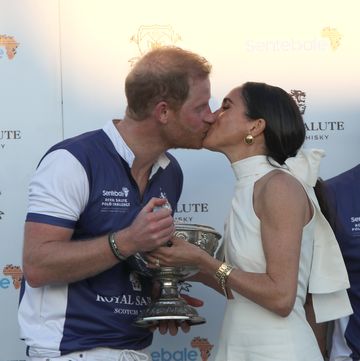 the duchess of sussex presents the trophy to her husband, the duke of sussex after his team the royal salute sentebale team defeated the grand champions team, in the royal salute polo challenge, to benefit sentebale, at the uspa national polo center in wellington, florida, us picture date friday april 12, 2024 photo by yaroslav sabitovpa images via getty images
