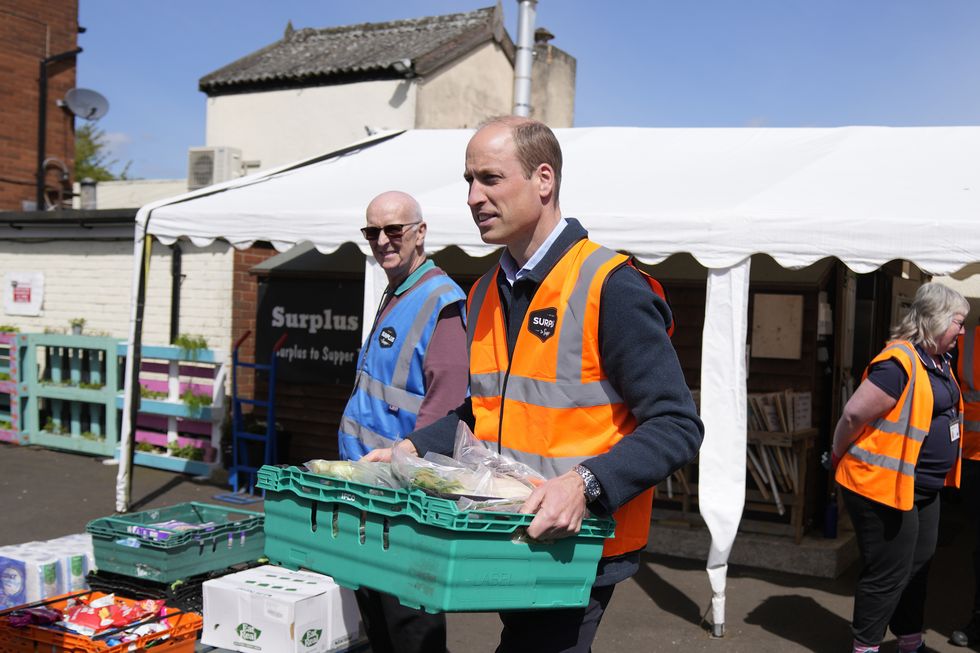 sunbury, england april 18 prince william, prince of wales helps to load trays of food into vans during a visit to surplus to supper, in sunbury on thames on april 18, 2024 in surrey, england the prince visited surplus to supper, a surplus food redistribution charity, to learn about its work bridging the gap between food waste and food poverty across surrey and west london photo by alastair grant wpa poolgetty images