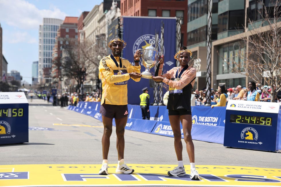 boston, massachusetts april 15 sisay lemma of ethiopia and hellen obiri of kenya pose with the trophy after winning the professional mens and womens divisions during the 128th boston marathon on april 15, 2024 in boston, massachusetts photo by paul rutherfordgetty images