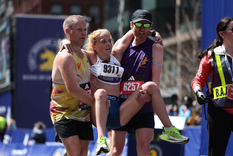 boston, massachusetts april 15 merritt blum is helped across the finish line during the 128th boston marathon on april 15, 2024 in boston, massachusetts photo by paul rutherfordgetty images