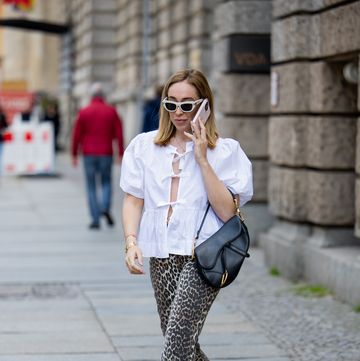 berlin, germany may 01 sonia lyson is seen wearing ballerinas zara, leopard print pants white blouse ganni, bag sunglasses dior, belt hermes on may 01, 2024 in berlin, germany photo by christian vieriggetty images