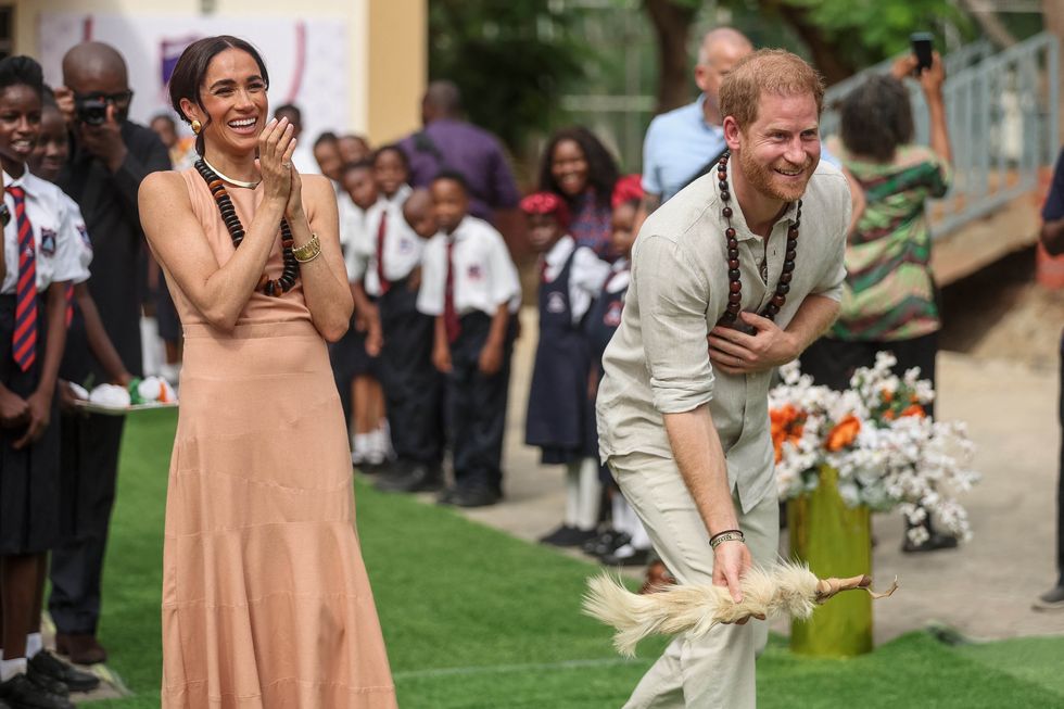 britain's prince harry r, duke of sussex, and britain's meghan l, duchess of sussex, take part in activities as they arrive at the lightway academy in abuja on may 10, 2024 as they visit nigeria as part of celebrations of invictus games anniversary photo by kola sulaimon afp