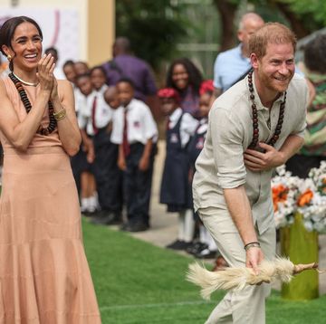 topshot britains prince harry r, duke of sussex, and britains meghan l, duchess of sussex, take part in activities as they arrive at the lightway academy in abuja on may 10, 2024 as they visit nigeria as part of celebrations of invictus games anniversary photo by kola sulaimon afp photo by kola sulaimonafp via getty images