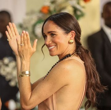 britains meghan, duchess of sussex, gestures as she arrives with britains prince harry unseen, duke of sussex, during their visit at the lightway academy in abuja on may 10, 2024 as they visit nigeria as part of celebrations of invictus games anniversary photo by kola sulaimon afp photo by kola sulaimonafp via getty images