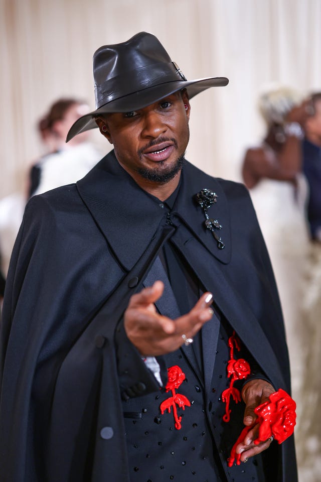 Usher Sports a Custom McQueen Look—and Cape—at the 2024 Met Gala