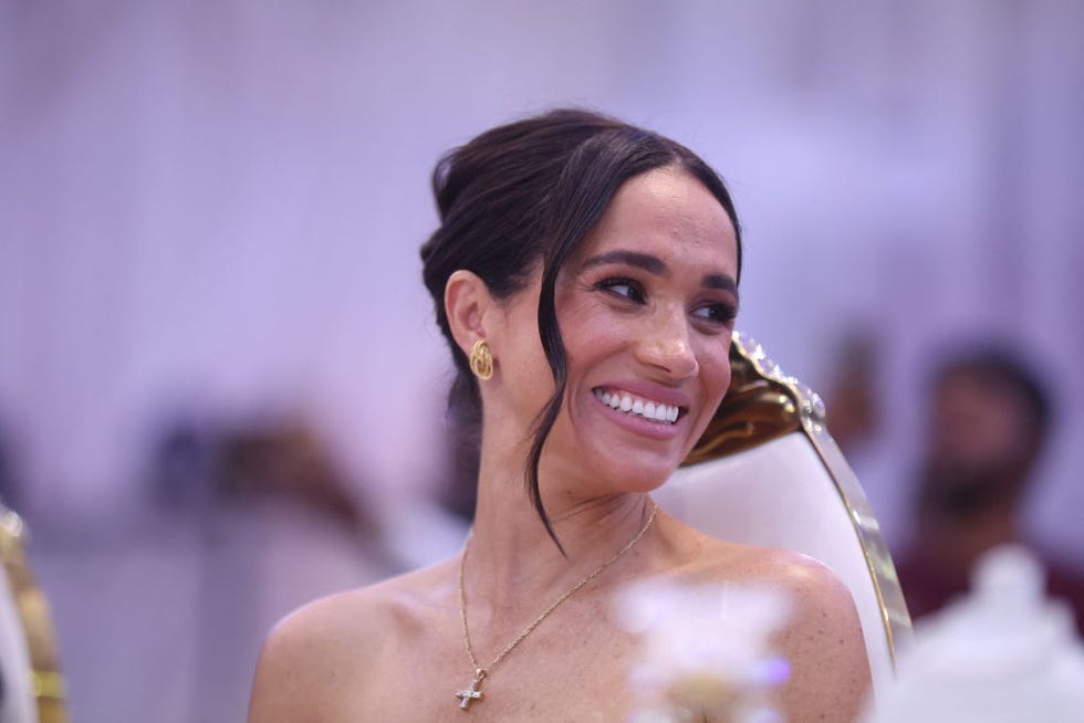 britains meghan, duchess of sussex, looks on as she attends a sit out with britains prince harry unseen, duke of sussex, at the nigerian defence headquarters in abuja on may 11, 2024 as they visit nigeria as part of celebrations of invictus games anniversary photo by kola sulaimon  afp photo by kola sulaimonafp via getty images