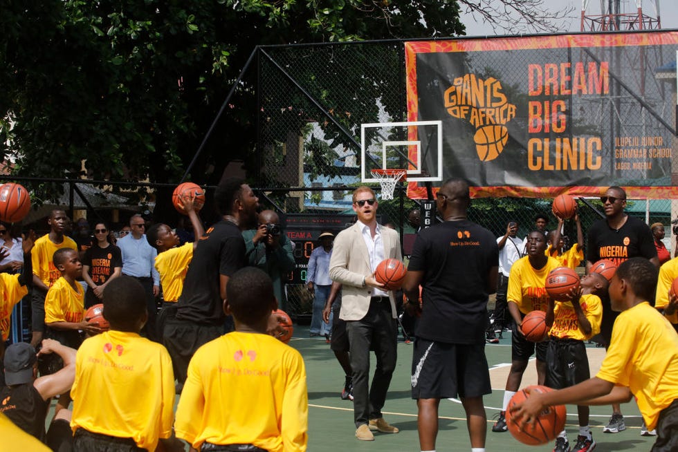 britains prince harry c, duke of sussex, takes part in a basketball exhibition training match at ilupeju grammar school in lagos on may 12, 2024 as he and britains meghan unseen, duchess of sussex visit nigeria as part of celebrations of invictus games anniversary photo by kola sulaimon  afp photo by kola sulaimonafp via getty images