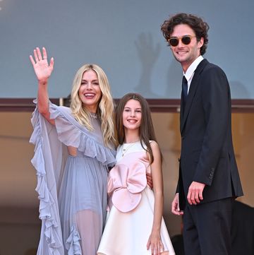 cannes, france may 19 sienna miller, marlowe ottoline layng sturridge and oli green attend the horizon an american saga red carpet at the 77th annual cannes film festival at palais des festivals on may 19, 2024 in cannes, france photo by stephane cardinale corbiscorbis via getty images