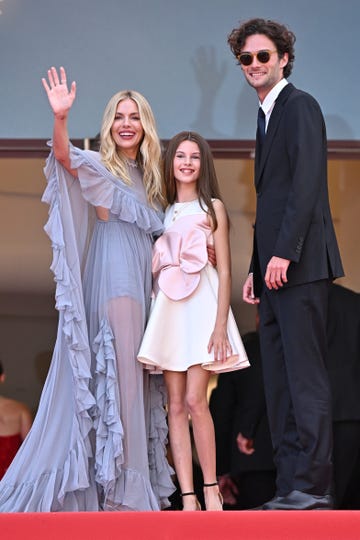 cannes, france may 19 sienna miller, marlowe ottoline layng sturridge and oli green attend the horizon an american saga red carpet at the 77th annual cannes film festival at palais des festivals on may 19, 2024 in cannes, france photo by stephane cardinale corbiscorbis via getty images