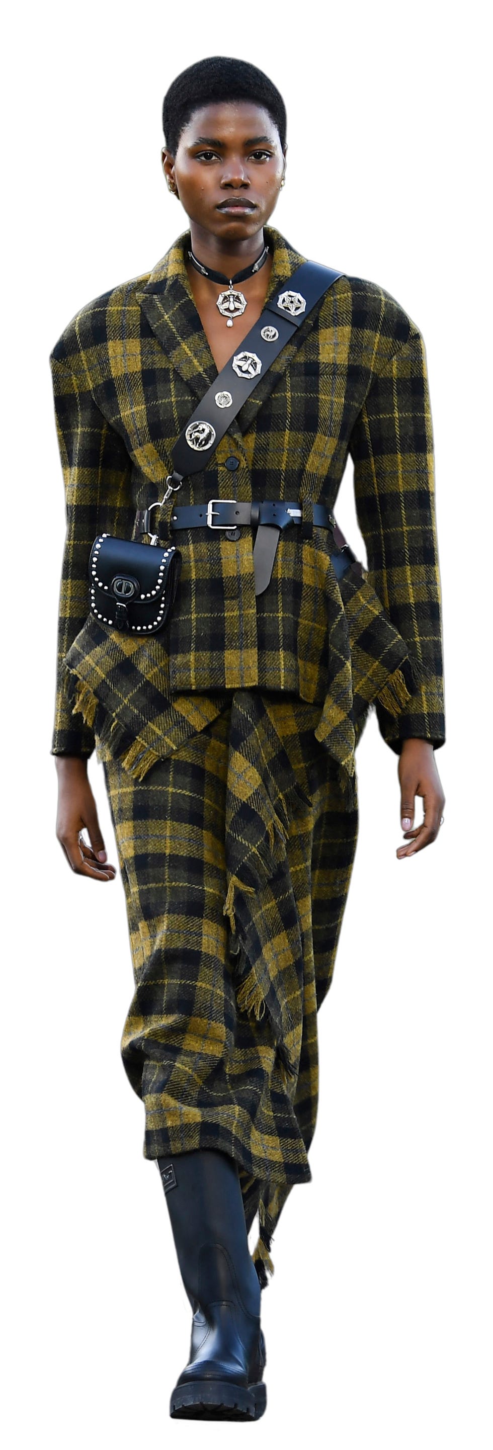 a model presents a tweet look for dior during the 2025 dior croisiere cruise fashion show