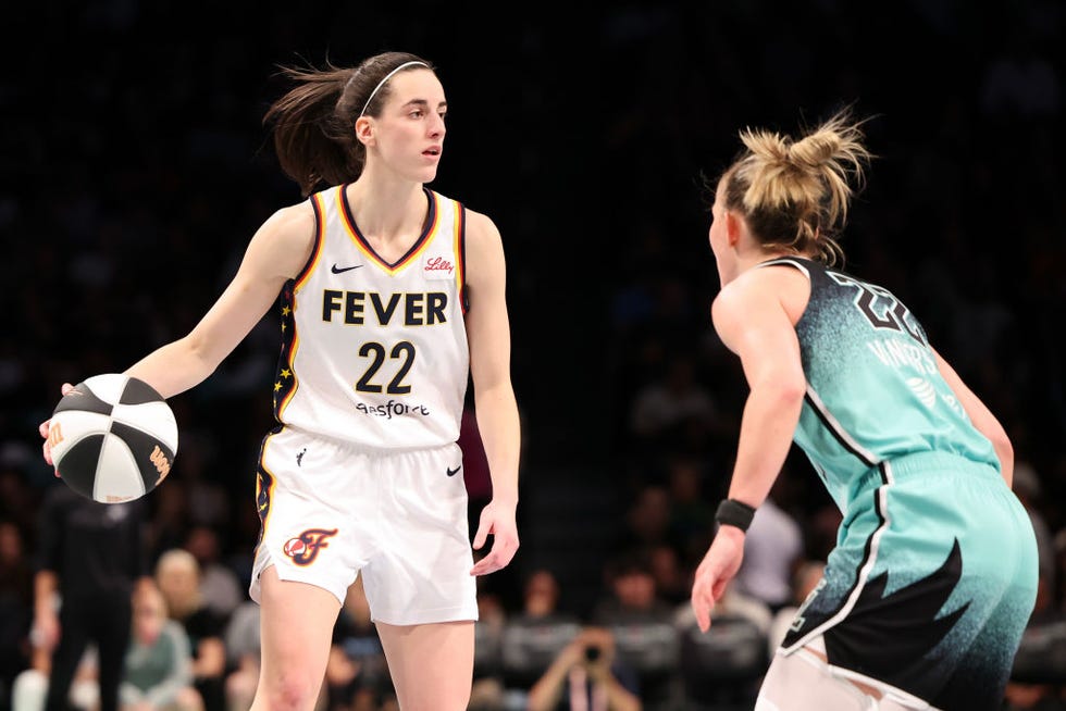 new york, new york june 02 caitlin clark 22 of the indiana fever works against courtney vandersloot 22 of the new york liberty during the third quarter in the game at barclays center on june 02, 2024 in the brooklyn borough of new york city note to user user expressly acknowledges and agrees that, by downloading and or using this photograph, user is consenting to the terms and conditions of the getty images license agreement photo by luke halesgetty images