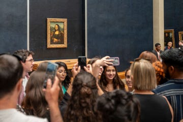 crowd of tourists with their smartphone in hand, taking a selfie with leonardo da vincis mona lisa inside the louvre museum in paris, france on 7 june 2024 photo by antoine boureau hans lucas hans lucas via afp photo by antoine boureauhans lucasafp via getty images