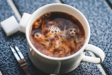 milk drip into coffee macrophotography