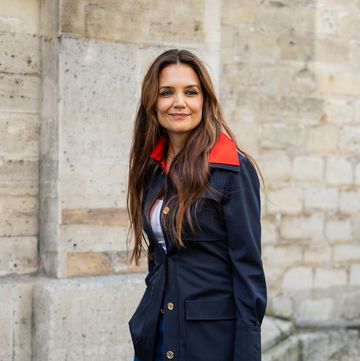 paris, france june 27 katie holmes wears navy red jacket, denim jeans, white bag outside patou during the haute couture fallwinter 20242025 as part of paris fashion week on june 27, 2024 in paris, france photo by christian vieriggetty images