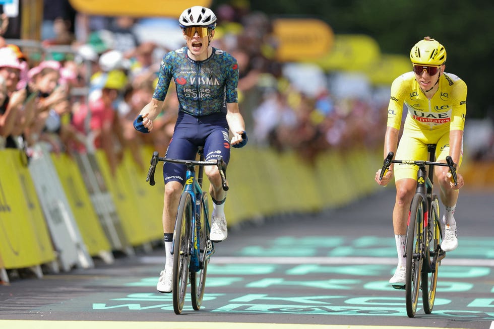 topshot team visma lease a bike team's danish rider jonas vingegaard cycles to the finish line to win ahead of uae team emirates team's slovenian rider tadej pogacar wearing the overall leader's yellow jersey (r) during the 11th stage of the 111th edition of the tour de france cycling race, 211 km between Évaux les bains and le lioran, on july 10, 2024. (photo by thomas samson / afp) (photo by thomas samson/afp via getty images)