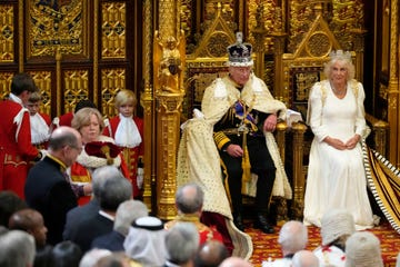 london, england july 17 king charles iii wearing the imperial state crown and the robe of state king charles iii, waits with queen camilla for members of the house of commons to arrive before reading the kings speech at the state opening of parliament in the house of lords on july 17, 2024 in london, england king charles iii delivers the kings speech setting out the new labour governments policies and proposed legislation for the coming parliamentary session photo by kirsty wigglesworth wpa poolgetty images