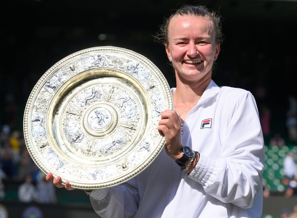 london, england july 13: barbora krejcikova of czechia poses with the ladies' singles trophy following victory against jasmine paolini of italy during her ladies' singles final match during day thirteen of the wimbledon tennis championships at the all england lawn tennis and croquet club on july 13, 2024 in london, england. (photo by karwai tang/wireimage)