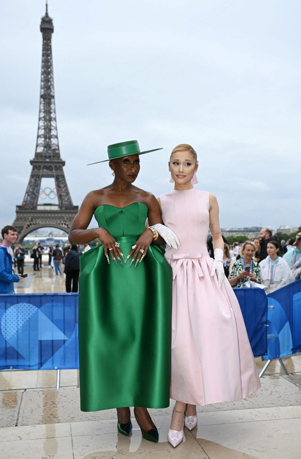 british actress and singer cynthia erivo l and us' singer ariana grande r arrive ahead of the opening ceremony of the paris 2024 olympic games in paris on july 26, 2024, as the eiffel tower is seen in the background photo by jonathan nackstrand afp