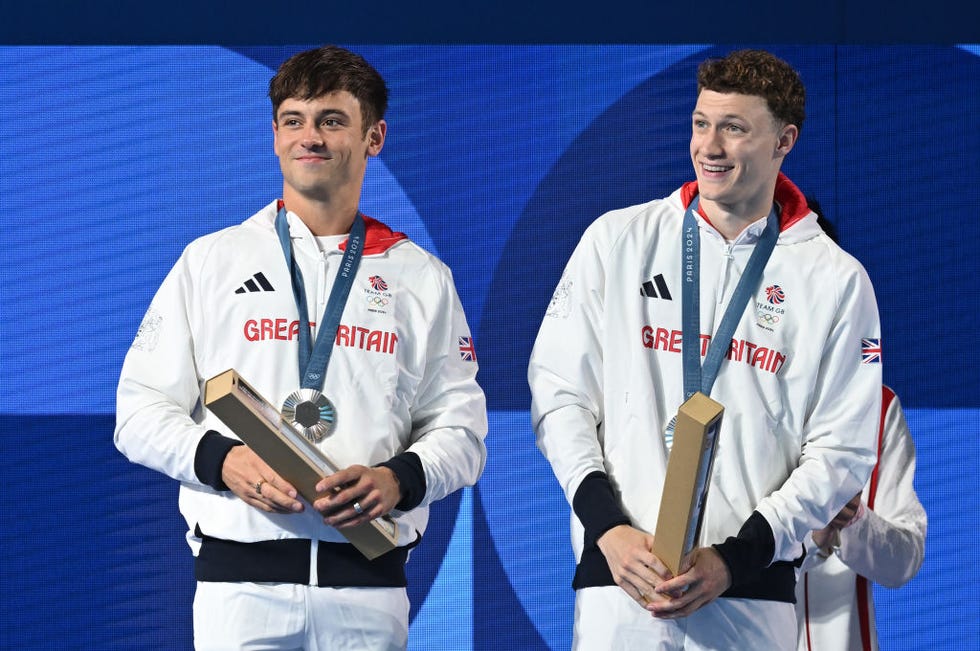 paris, france july 29 tom daley and noah williams of great britain look on from the winners podium with their silver medals after the men’s synchronised 10m final on day three of the olympic games paris 2024 at aquatics centre on july 29, 2024 in paris, france photo by patrick khachfegetty images