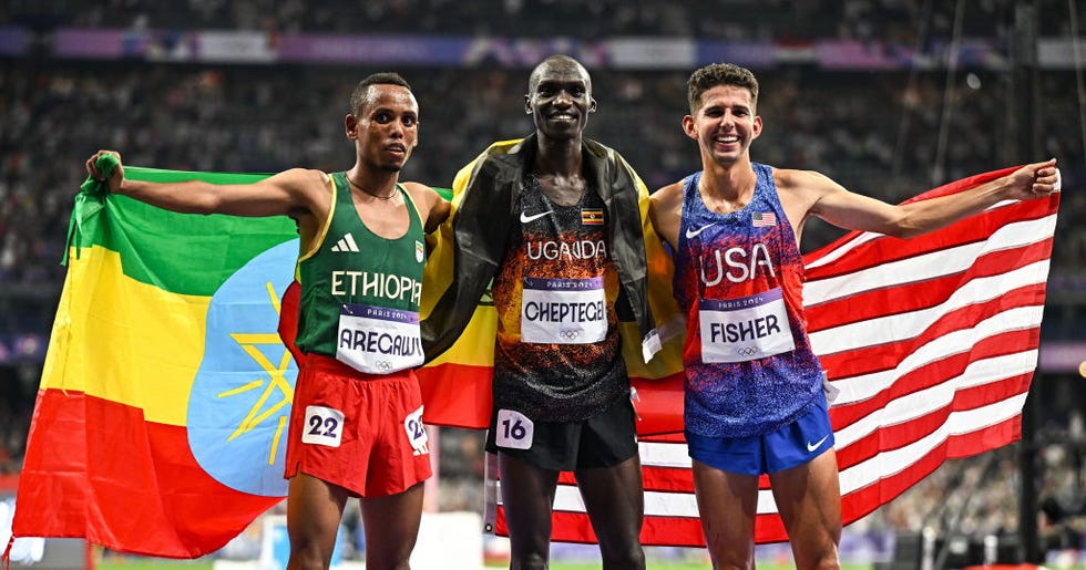 paris , france 2 august 2024 mens 10,000m medallists, from left, silver medallist berihu aregawi of team ethiopia, gold medallist joshua cheptegei of team uganda, and bronze medallist grant fisher of team usa at the stade de france during the 2024 paris summer olympic games in paris, france photo by sam barnessportsfile via getty images