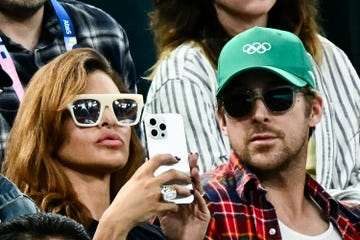 us actress eva mendes l and her partner canadian actor ryan gosling r attend the artistic gymnastics womens uneven bars final during the paris 2024 olympic games at the bercy arena in paris, on august 4, 2024 photo by loic venance  afp photo by loic venanceafp via getty images