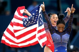 paris, france august 01 gold medalist simone biles and bronze medalist sunisa lee of team united states celebrate with the american flag after competing in the artistic gymnastics womens all around final on day six of the olympic games paris 2024 at bercy arena on august 01, 2024 in paris, france photo by pascal le segretaingetty images