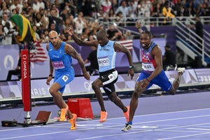 us noah lyles r crosses the finish line ahead of botswanas letsile tebogo c and italys lamont marcell jacobs l in the mens 100m final of the athletics event at the paris 2024 olympic games at stade de france in saint denis, north of paris, on august 4, 2024 photo by andrej isakovic afp photo by andrej isakovicafp via getty images