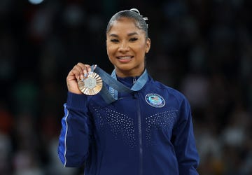 bronze medalist jordan chiles of the united states poses for photos during the victory ceremony of womens floor exercise of artistic gymnastics at the paris 2024 olympic games in paris, france, aug 5, 2024 photo by cao canxinhua via getty images