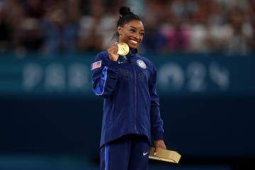 paris, france august 03 gold medalist simone biles of team united states celebrates on the podium during the medal ceremony for the artistic gymnastics womens vault final on day eight of the olympic games paris 2024 at bercy arena on august 03, 2024 in paris, france photo by julian finneygetty images