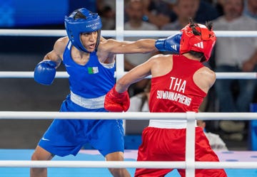 paris, france august 6 imane khelif blue of algeria competes against janjaem suwannapheng red of thailand in the womens 66kg semi final boxing match during the paris 2024 olympic games at the roland garros stadium, in paris, france on august 6, 2024 khelif wins the match and advanced to final photo by aytac unalanadolu via getty images