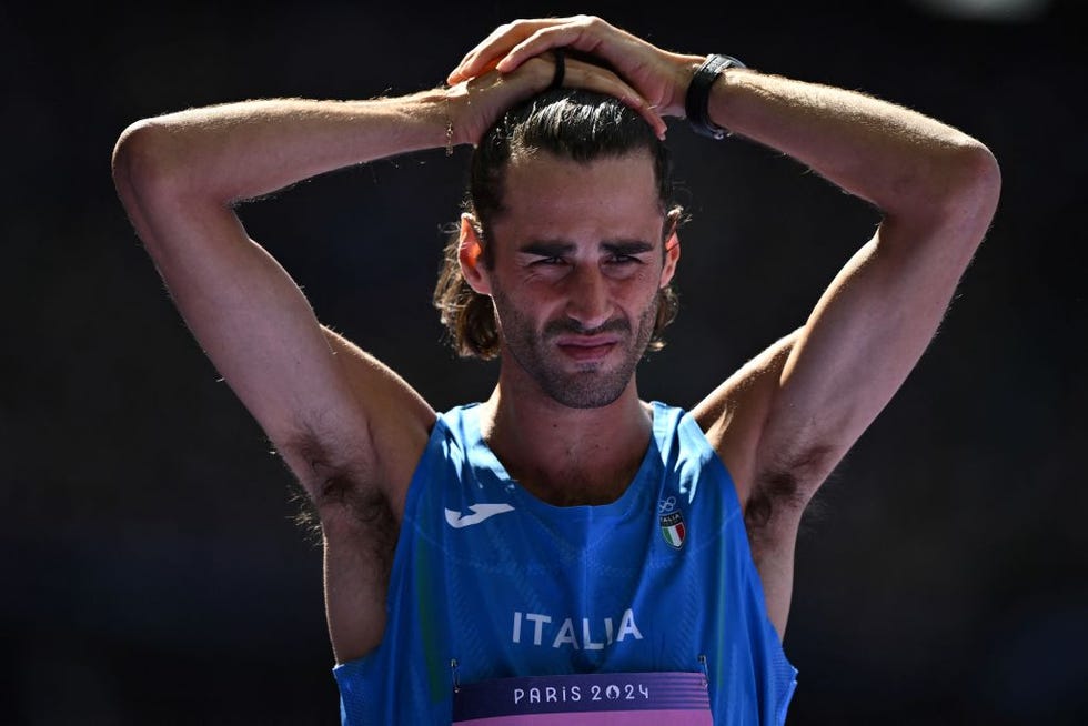 italys gianmarco tamberi reacts as he competes in the mens high jump qualification of the athletics event at the paris 2024 olympic games at stade de france in saint denis, north of paris, on august 7, 2024 photo by ben stansall afp photo by ben stansallafp via getty images