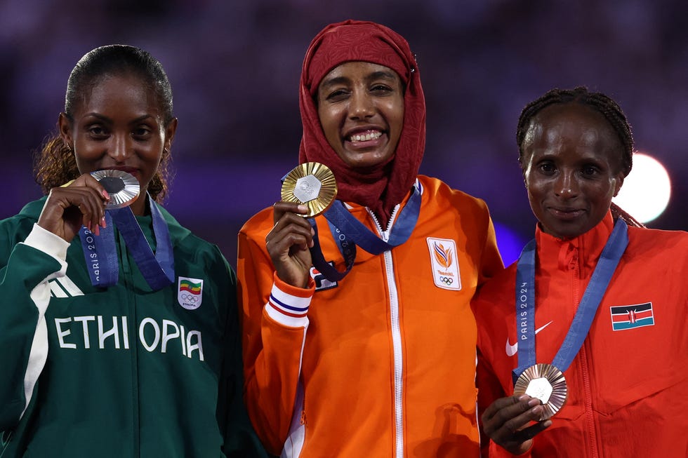 l r silver medallist ethiopias tigst assefa, gold medallist netherlands sifan hassan and bronze medallist kenyas hellen obiri pose during the podium ceremony for the womens marathon of the athletics event during the closing ceremony of the paris 2024 olympic games at the stade de france, in saint denis, in the outskirts of paris, on august 11, 2024 photo by franck fife  afp photo by franck fifeafp via getty images