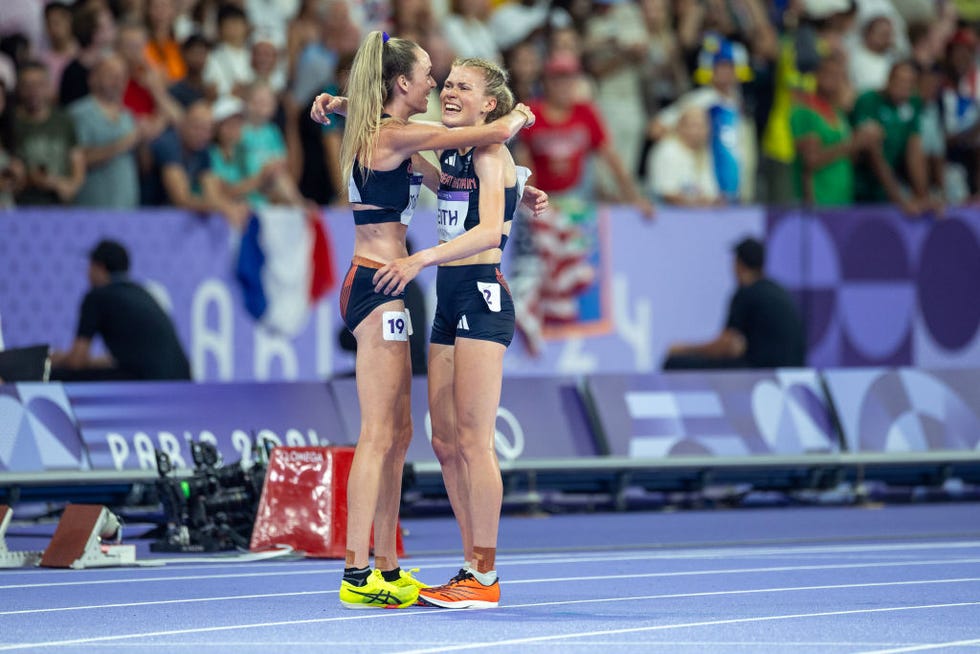 Paris, France, August 9: Megan Keith of Great Britain is consoled by her teammate Eilish McColgan of Great Britain after finishing last in the women's 10,000m final during the athletics competition at the Stade de France during the Paris 2024 Summer Olympic Games on August 9, 2024 in Paris, France. Photo by Tim Claytoncorbis via Getty Images