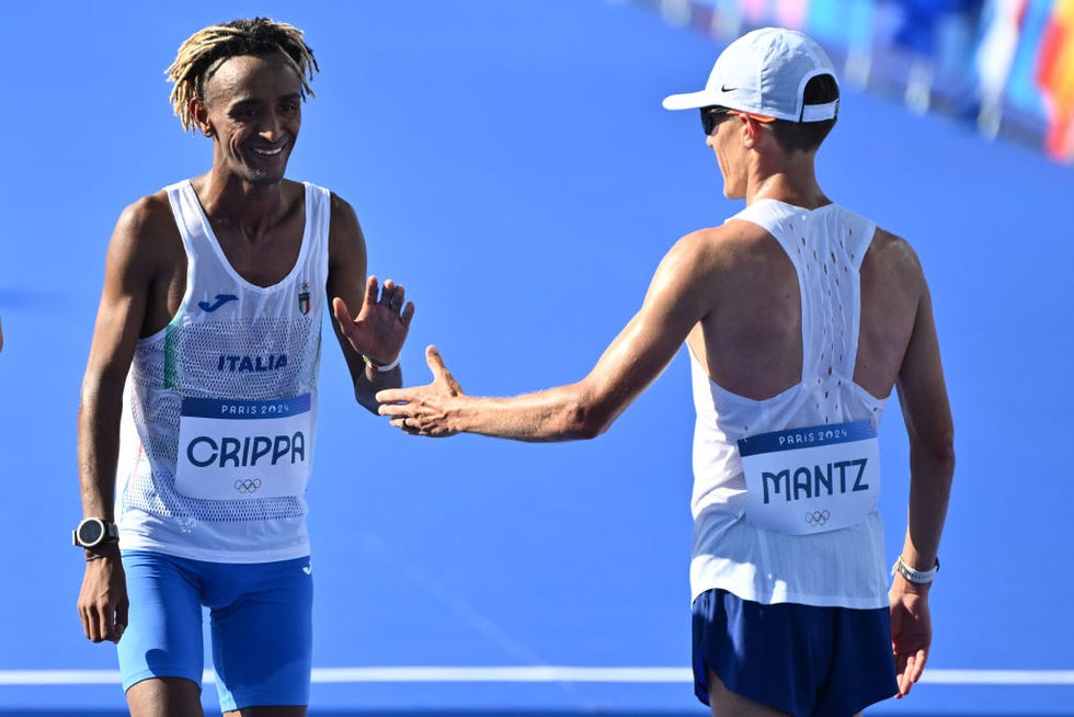 paris, france august 10 yemaneberhan crippa of italy and conner blair mantz of united states at the end of mens marathon on day fifteen of the olympic games paris 2024 at esplanade des invalides on august 10, 2024 in paris, france photo by image photo agencygetty images