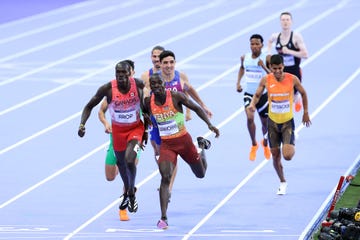 paris, france august 10: emmanuel wanyonyi of team kenya crosses the finish line to win the gold medal in front of silver medalist marco arop of team canada the mens 800m final on day fifteen of the olympic games paris 2024 at stade de france on august 10, 2024 in paris, france. (photo by cameron spencer/getty images)