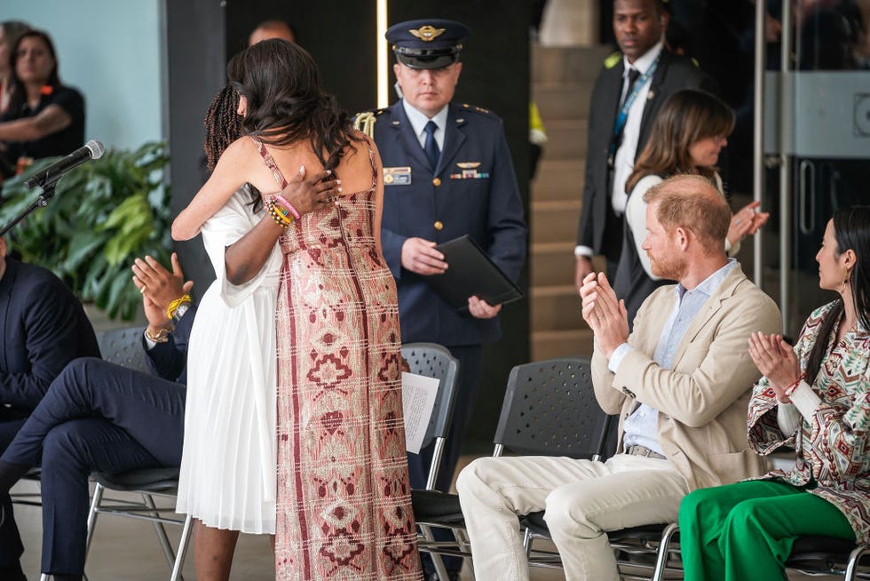 BOGOTA, Colombia August 15 Colombian Vice President Francia Marquez and Meghan, Duchess of Sussex, hug each other as Prince Harry, Duke of Sussex, looks on at the National Center for the Arts Delia Zapata on August 15, 2024 in Bogota, Colombia Photo by Diego Cuevas Getty Images