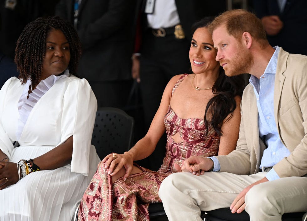 britains prince harry c, duke of sussex, listens to his wife meghan markle c, next to colombias vice president francia marquez while attending a performance during a visit to the national centre for the arts in bogota on august 15, 2024 prince harry and his wife, american actress meghan markle, arrived in colombia at the invitation of marquez, with whom they will attend various meetings with women and young people to reject discrimination and cyberbullying photo by raul arboleda afp photo by raul arboledaafp via getty images