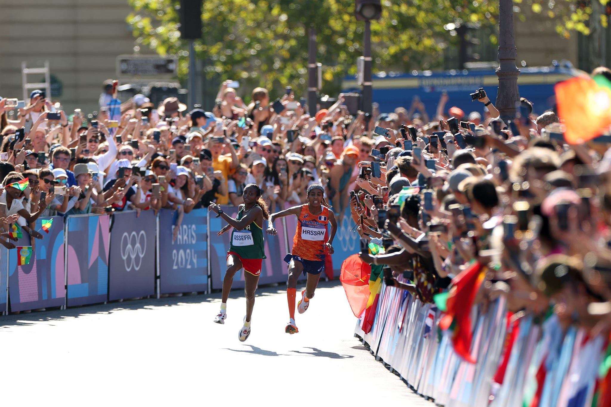 tigst assefa of team ethiopia and sifan hassan of team netherlands collide during the womens marathon on day sixteen of the olympic games paris 2024