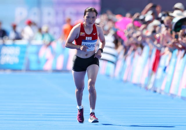 paris, france august 11 kinzang lhamo of team bhutan competes during the womens marathon on day sixteen of the olympic games paris 2024 at esplanade des invalides on august 11, 2024 in paris, france photo by michael steelegetty images